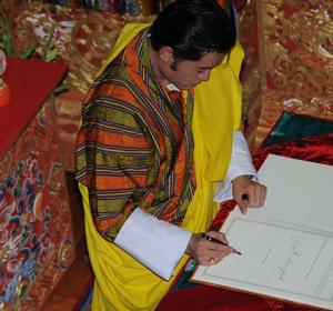 July 18, 2008:  His Majesty the King signs the Constitution of Bhutan